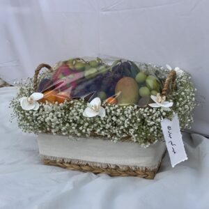 Fruits basket with flower arrangement for 310 dirhams Fruits basket medium size .. Fresh fruits by air cargo Nothing can be added to the cotton card (Limited number, please book from now